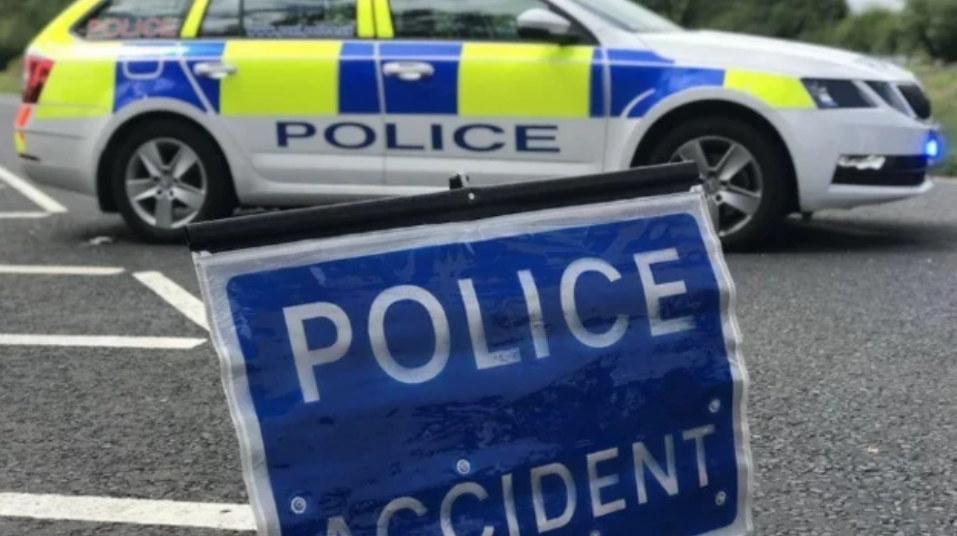 Generic Image of a police car and road sign which reads "police accident"