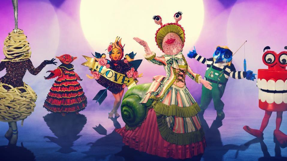 Six of The Masked Singer characters.