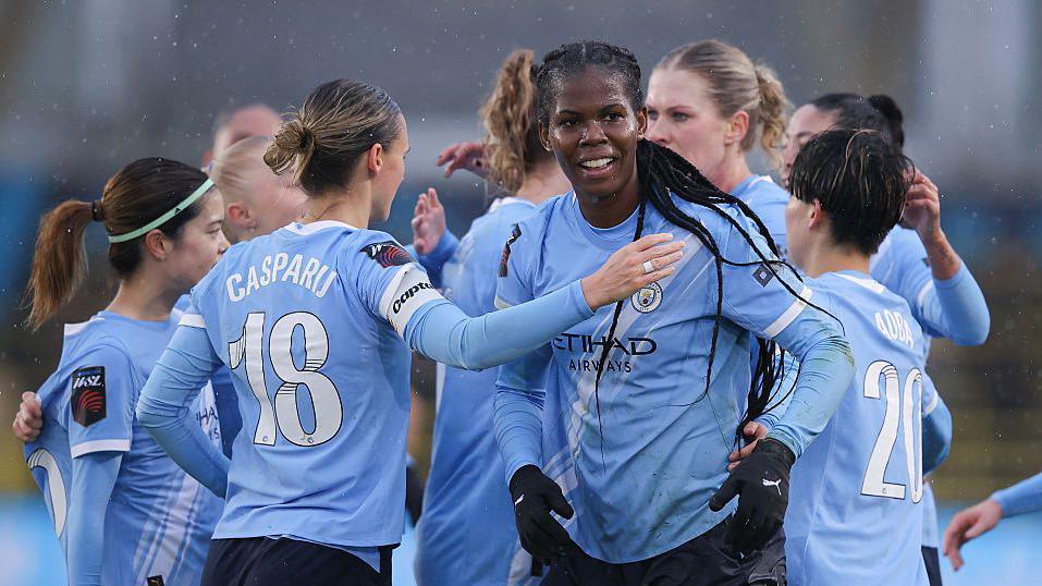 Manchester City women celebrate scoring against Aston Villa