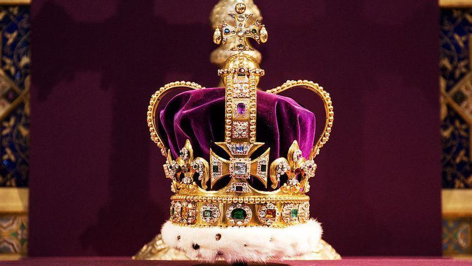 St Edward's Crown, the crown used to Royal coronations, made up of a solid gold frame set with rubies, amethysts, sapphires, garnet, topazes and tourmalines. The crown has a velvet cap with an ermine band. 