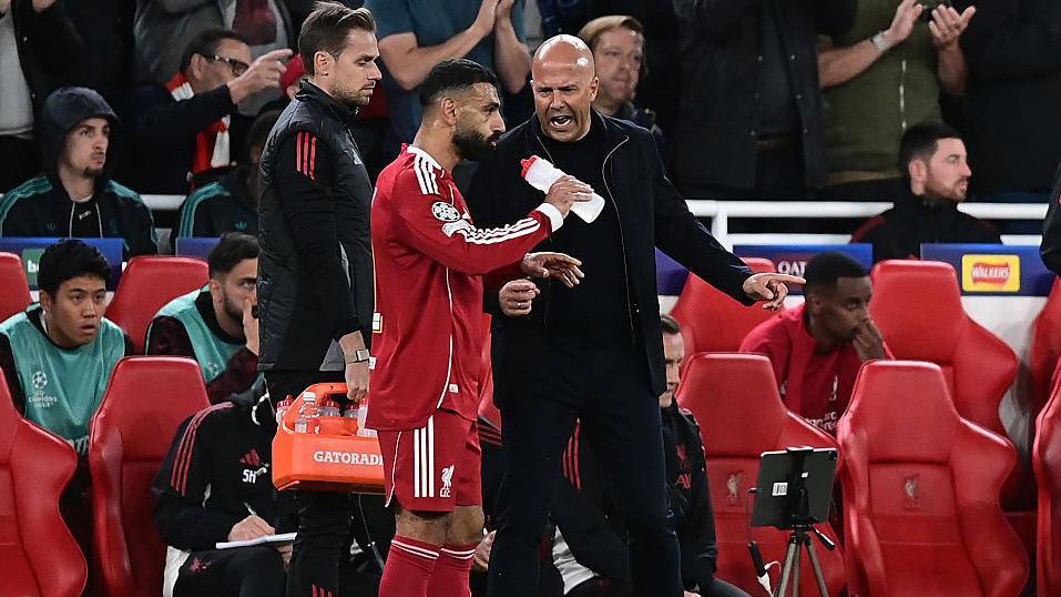 Mohamed Salah and Arne Slot in discussion with one another