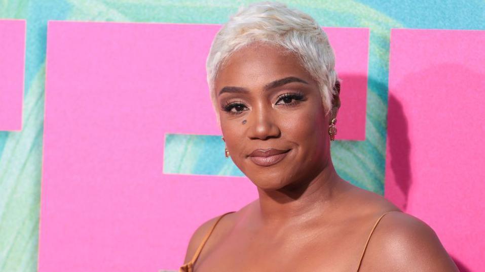 An image of Tiffany Haddish on the red carpet with blonde hair