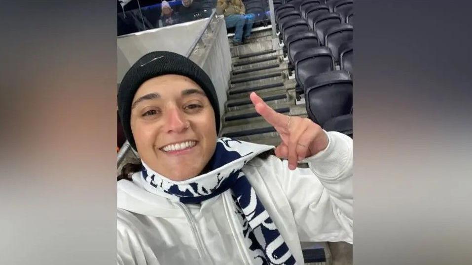 Family handout showing Emily Damari wearing a Tottenham Hotspur scarf at a football match