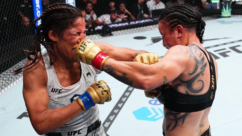 Julianna Pena and Raquel Pennington land punches on each other at the same time