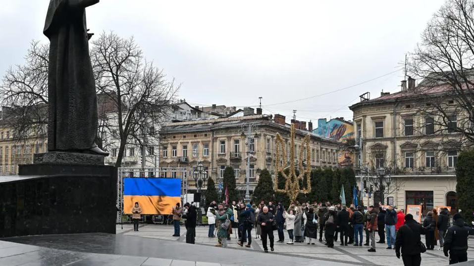 A group of people in the main square in Lviv, Ukraine.