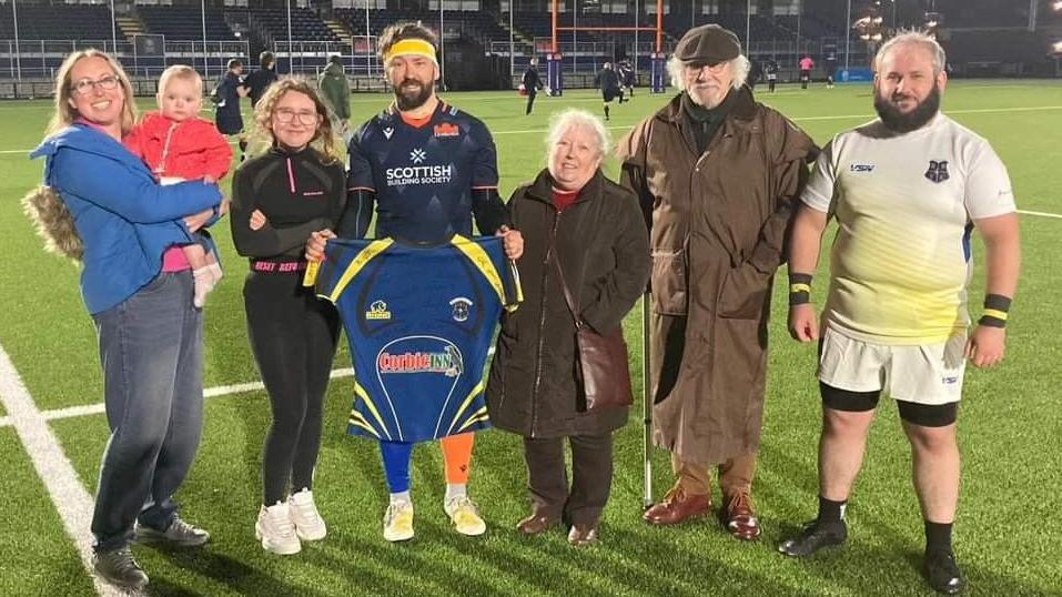 Grant Anderson with his wife, children, parents and brother at the end of his last rugby match playing for Edinburgh Inclusive Rugby Team