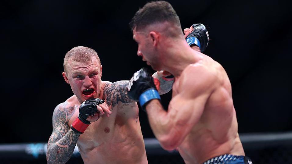 Mason Jones lands a punch on Axel Sola
