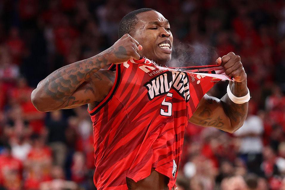 Kristian Doolittle tears his basketball top in exasperation after the Wildcats are beaten in an NBL match by the Adelaide 36ers