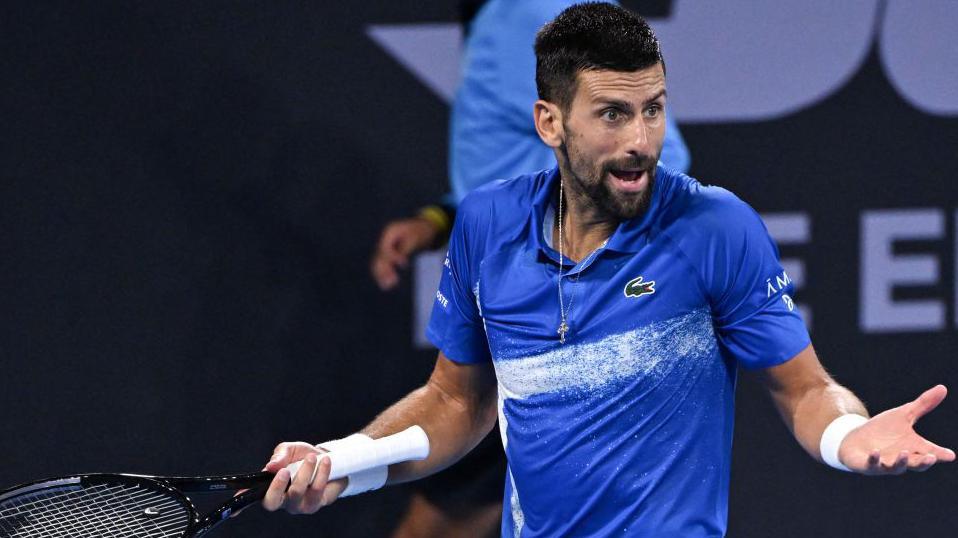 Serbia's Novak Djokovic reacts during his men's singles quarter-final match against USA's Reilly Opelka at the Brisbane International. 