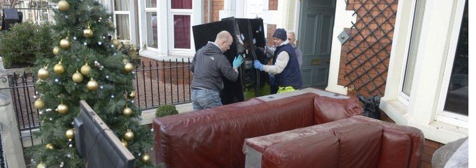 Residents clean out their house in Carlisle