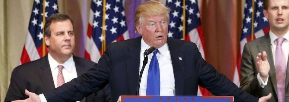 Republican U.S. presidential candidate Donald Trump speaks about the results of Super Tuesday primary and caucus voting as former rival candidate Governor Chris Christie (L) and his son Eric (R) look on during a news conference in Palm Beach, Florida on 1 March 2016.