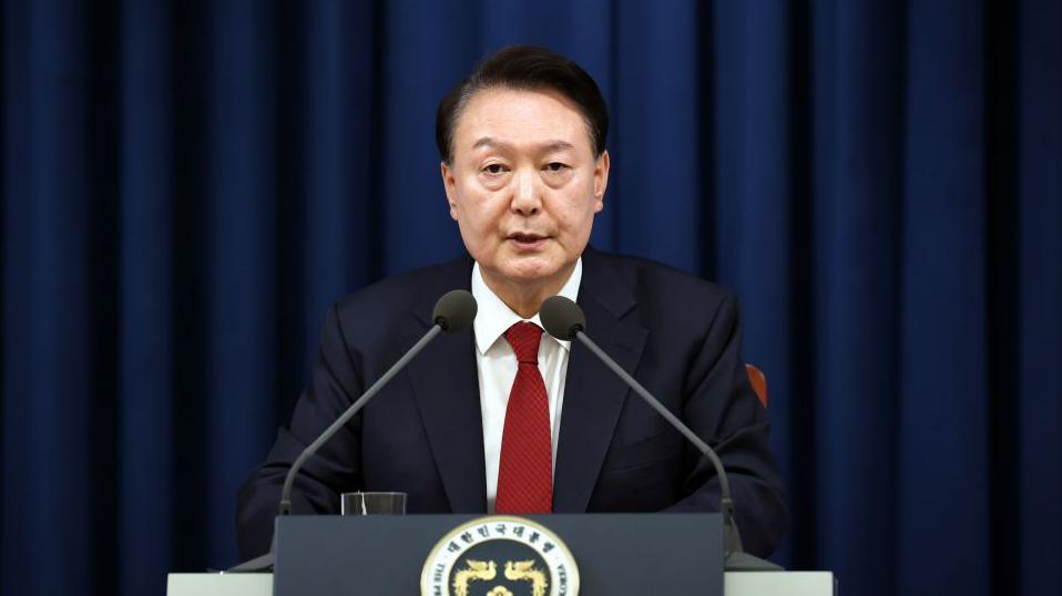 South Korean President Yoon Suk-Yeol speaks during the declaration of emergency martial law at the Presidential Office on December 03, 2024 in Seoul