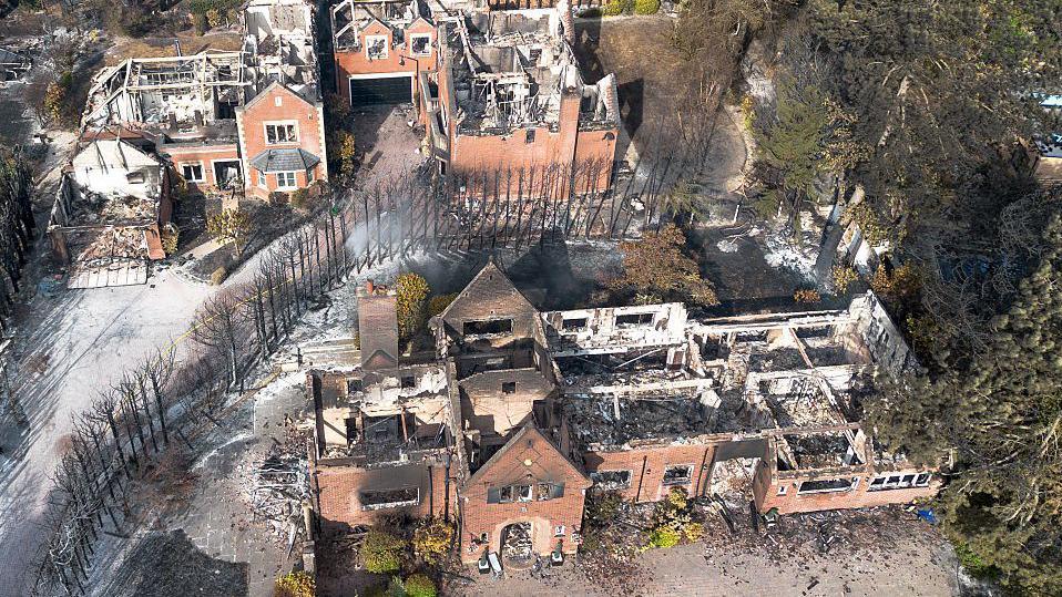 An aerial view of the remains of a home on Brunswick Gate following a huge fire in Stourbridge. The house roofs are burnt out.