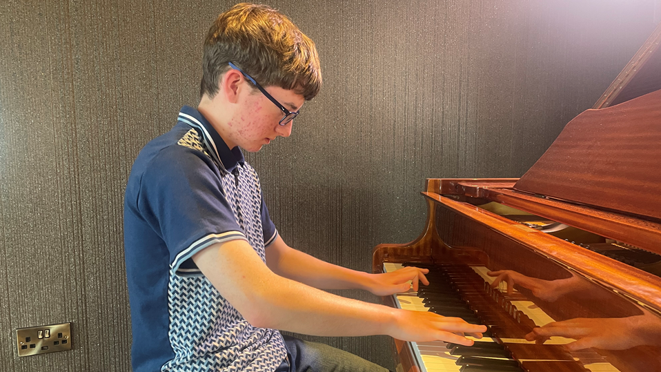 Cory McReynolds playing the piano