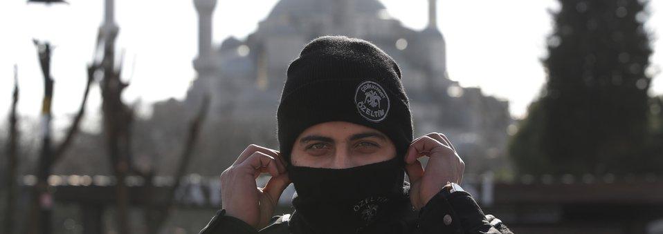 Backdropped by the Sultan Ahmed Mosque, better known as the Blue Mosque in the historic Sultanahmet district of Istanbul, a police officer secures the area after an explosion