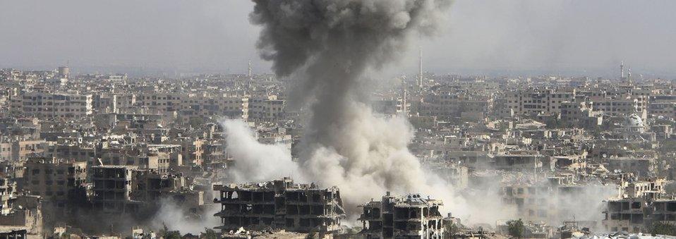 smoke rises after shelling by the Syrian army in Jobar, Damascus