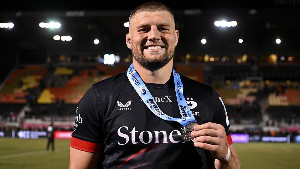 Tom Willis poses with his player of the match medal