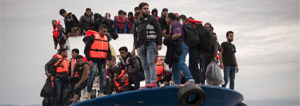 File photo of migrants and refugees arrive at the Greek island of Lesbos