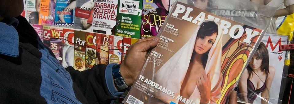 A man looks at a Playboy magazine in Mexico City