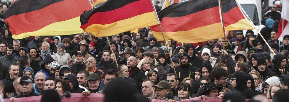 Right-wing activists gather to march in the city centre and protest against German Chancellor Angela Merkel on March 12, 2016