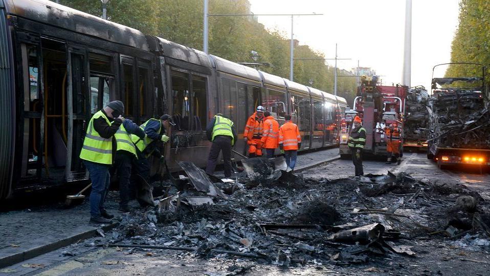 A Luas tram and buses were among vehicles destroyed by rioters