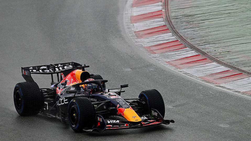 Max Verstappen drives the new Red Bull during wet conditions in Barcelona testing
