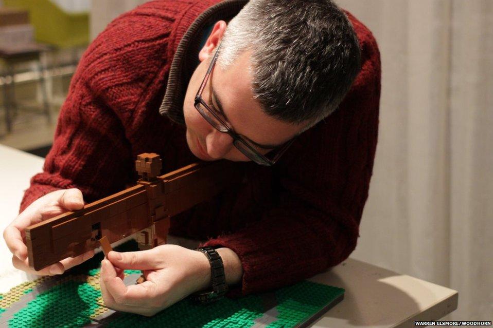 Artist Warren Elsmore puts the final touches on the Angel of the North