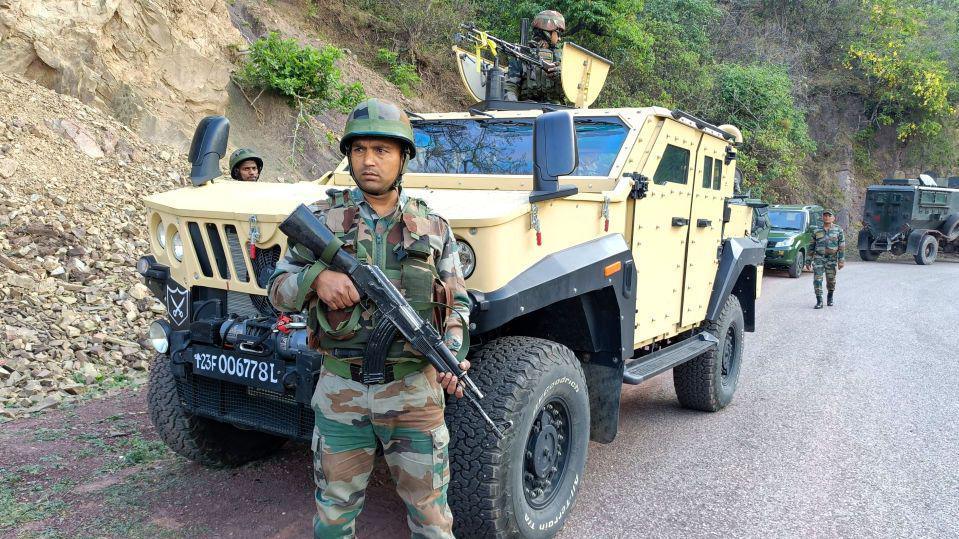 Indian army personnel look on during a search operation in Reasi on June 10, 2024, after gunmen in Kashmir ambushed the bus packed with Hindu pilgrims. Soldiers in India-administered Kashmir carried out a large-scale manhunt on June 10, the government said, a day after nine Hindu pilgrims were killed in one of the deadliest recent attacks on civilians, around an hour before Hindu-nationalist Prime Minister Narendra Modi was sworn in for a third term in the capital New Delhi on June 9 evening. (Photo by AFP) (Photo by -/AFP via Getty Images)