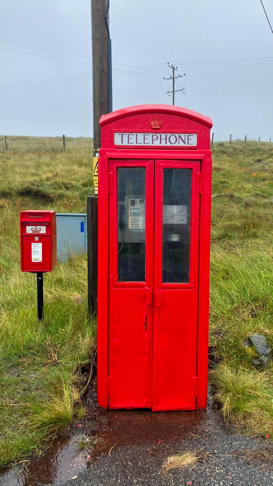 A double-door red telephone box on the Isle of Lewis.