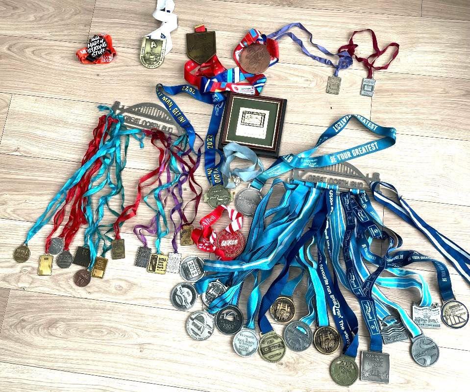 A collection of medals on a floor. 