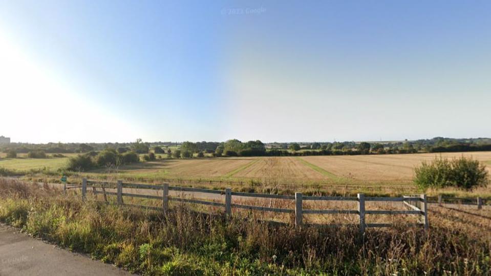 A fenced in field  off the M1

