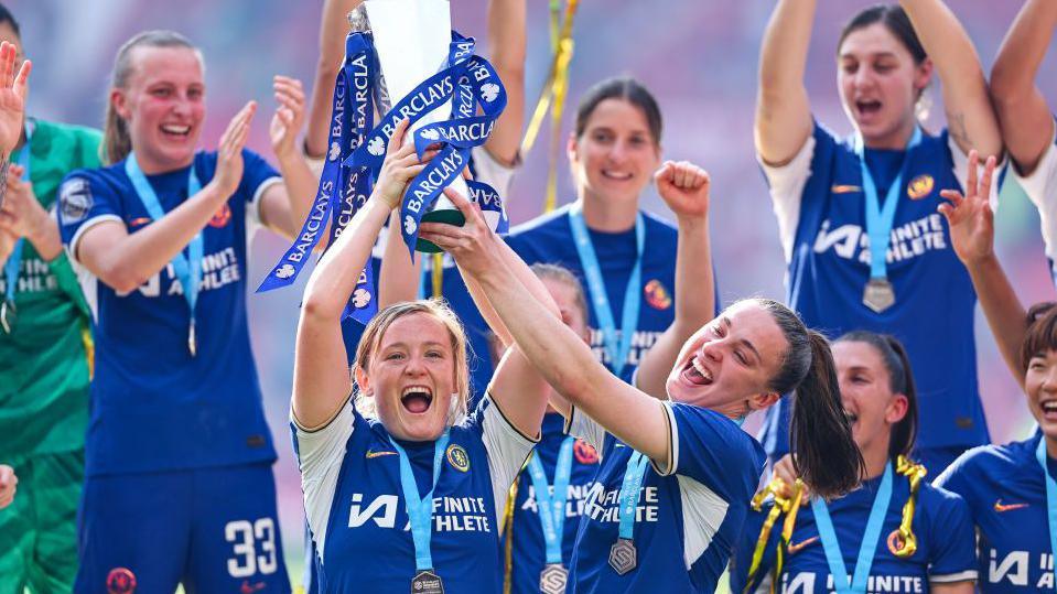 Erin Cuthbert and Niamh Charles of Chelsea Women celebrate with the Womens Super League trophy 