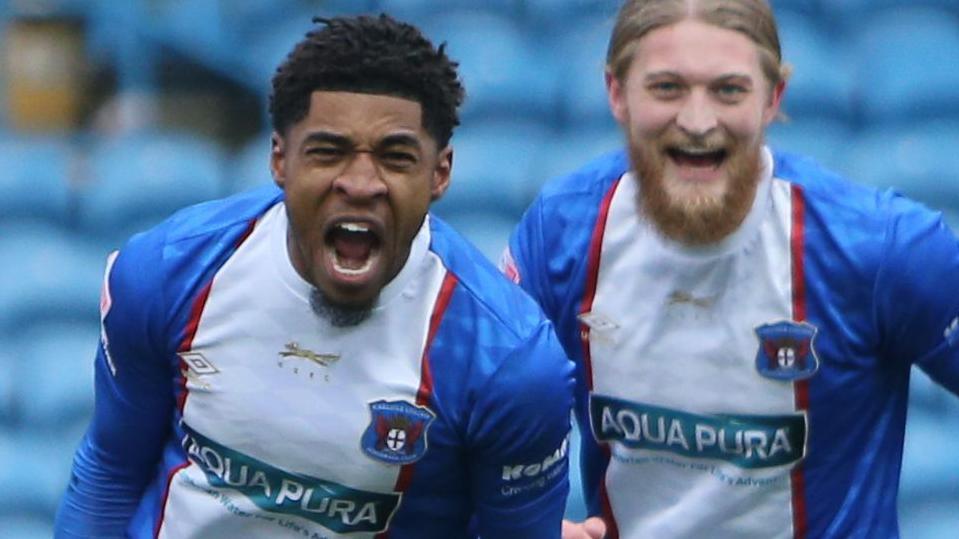 Kadeem Harris (left) celebrates a goal for Carlisle