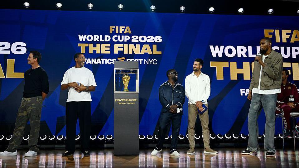 Tom Brady, Rio Ferdinand, Kevin Hart, Novak Djokovic and Kevin Durant on stage at Fanatics Fest before the 2026 World Cup final