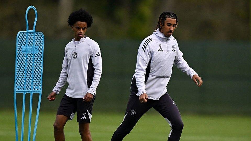 Manchester United youngster Yuel Helafu and first-team player Leny Yoro during training