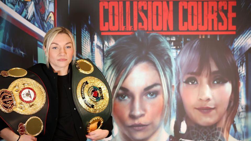 Lauren Price posing in front of poster advertising the fight night