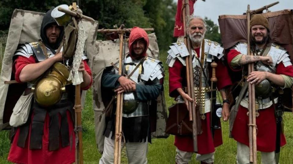 Chris, Andrew, Neil and Dan dressed as Roman soldiers 