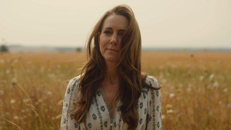 Catherine, Princess of Wales, stands in a field in Norfolk looking towards the camera in a film released by Kensington Palace