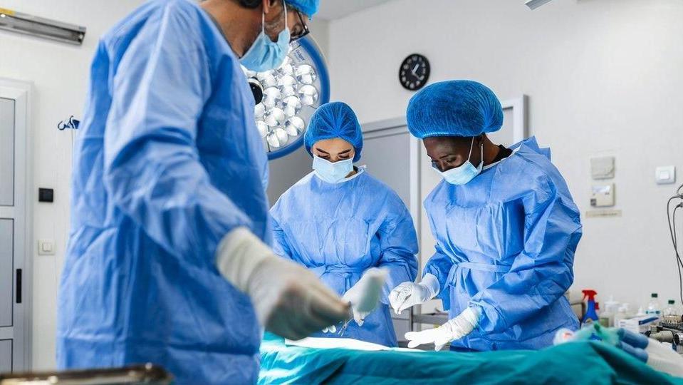 Doctors in operating theatre