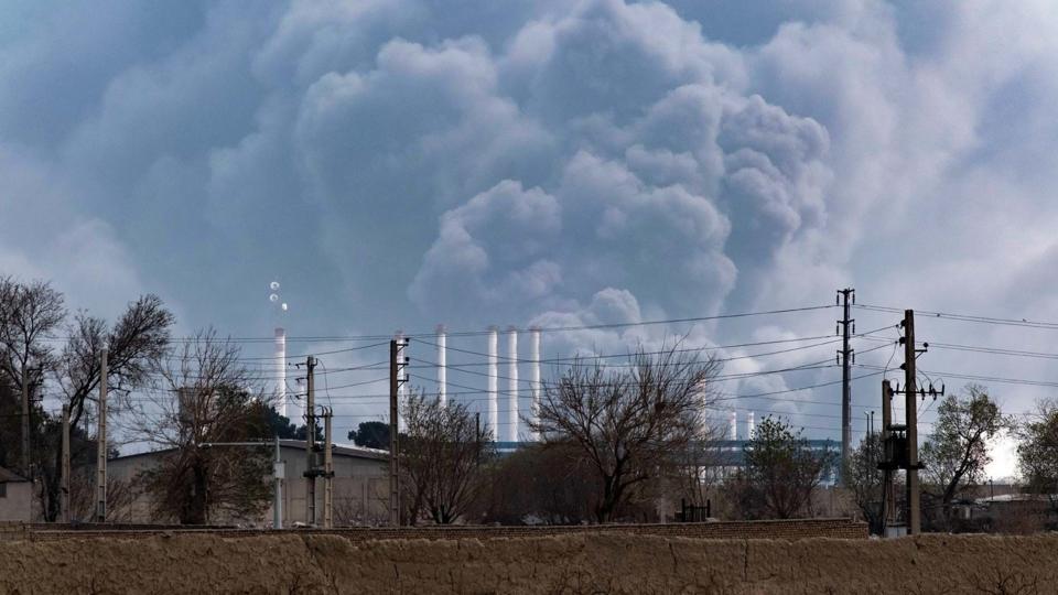 The sky is darkened by oil-soot residue from Tehran's petroleum storage facilities, which are struck during a U.S.-Israeli military campaign in Tehran, Iran, on March 9, 2026.