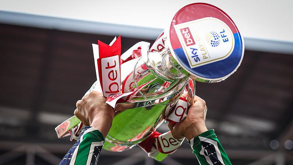 The Championship play-off final trophy being lifted
