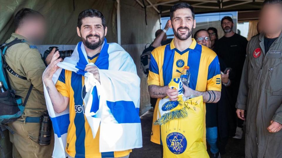 Gali and Ziv Berman on their way to the hospital, pictured in yellow football shirts