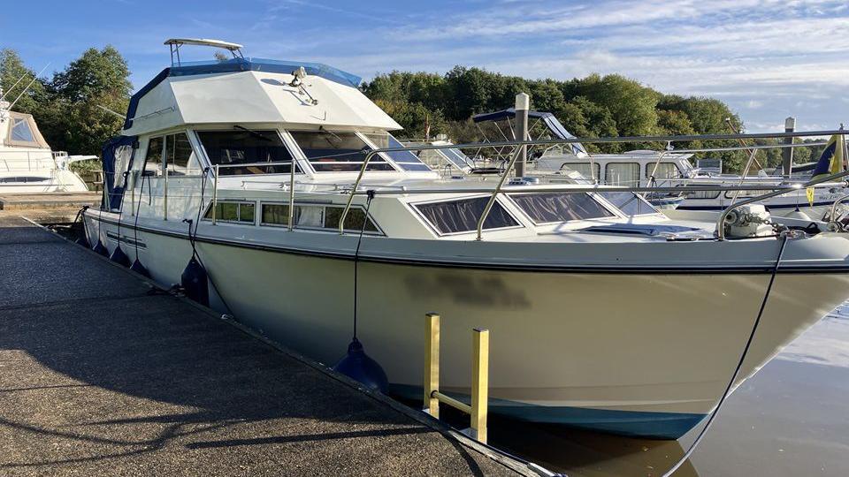 A boat docked in a marina. 