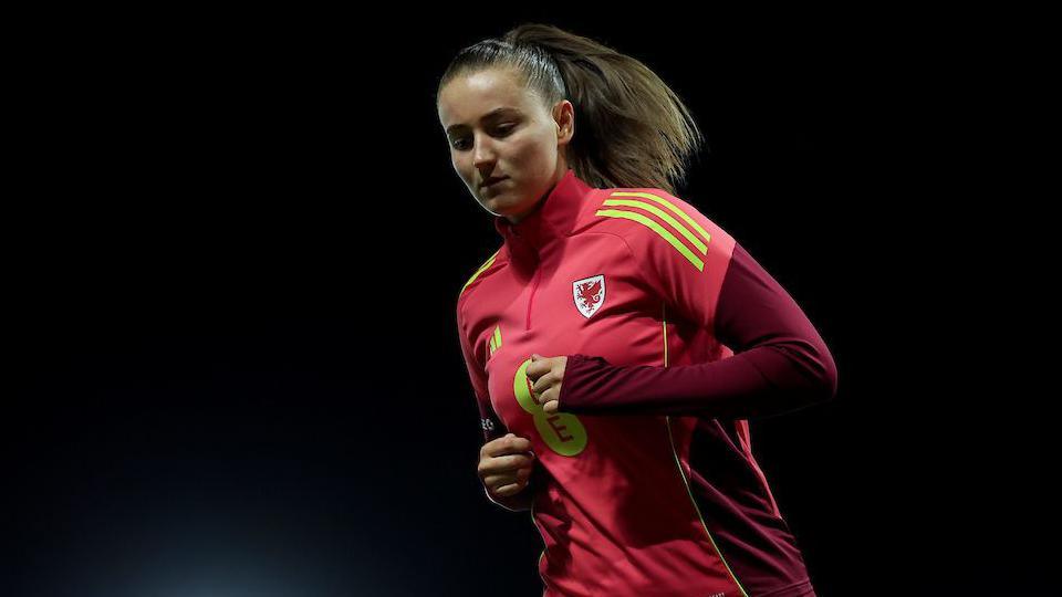 Mia Ross warms up in Wales colours  