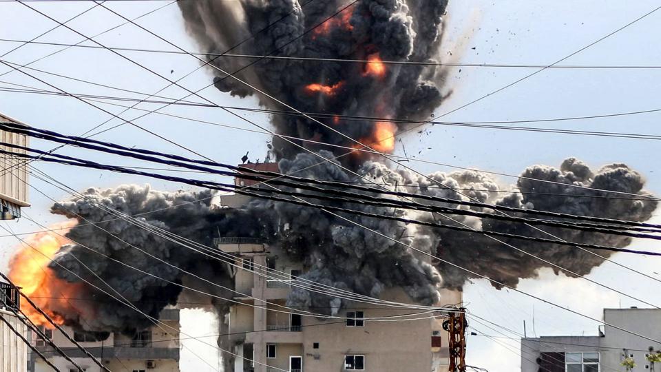 A fireball rises from a building hit by an Israeli airstrike in the area of Abbasiyeh, on the outskirts of the southern Lebanese city of Tyre, on April 8, 2026. Lebanon's army warned people against returning to the country's south on April 8, where the Israeli military is still launching attacks, as Israel said the ceasefire with Iran did not include its conflict with Hezbollah.