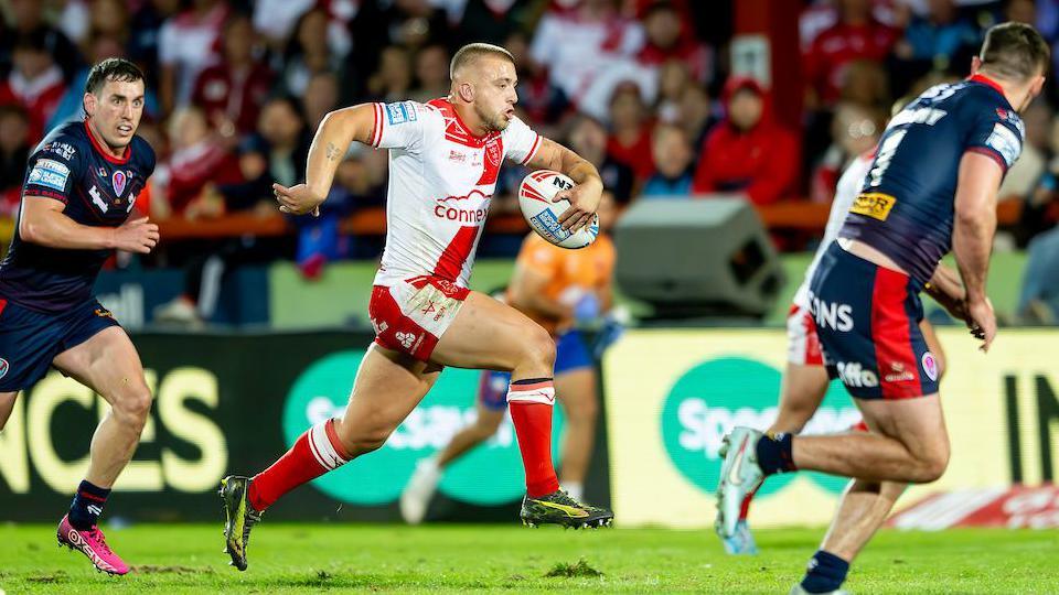 Hull KR half-back Mikey Lewis breaks clear during the second half against St Helens