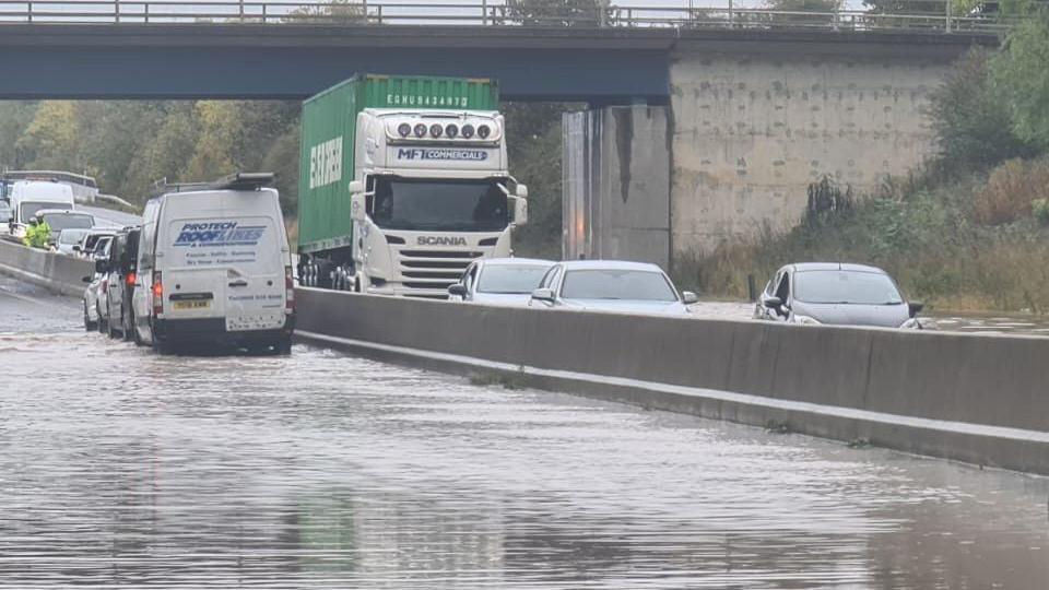 The A1 in County Durham. There is a lot of water with several vehicles on the road.