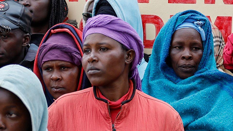 Parents and members of the community gather outside the Nyeri county's Hillside Endarasha Academy in Nyeri county on September 6, 2024 after a fire broke out killing 17 children. 