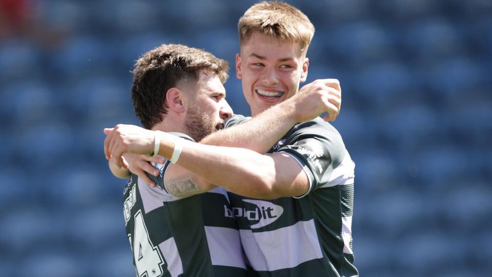 Fenton Rogers (left) holds out his arms to celebrate scoring Huddersfield Giants' second try in their win over Catalans Dragons