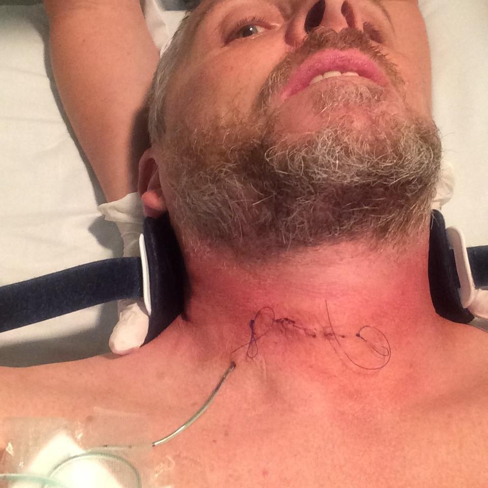 Jamie with stitches in his neck